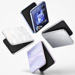 A glittering HONOR Magic V Flip 2 foldable phone open to display, showing sleek holographic design and dual OLED screens.