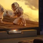 Hisense L9Q ultra-short-throw laser TV projector casting a bright, cinematic 200-inch image in a modern living room.