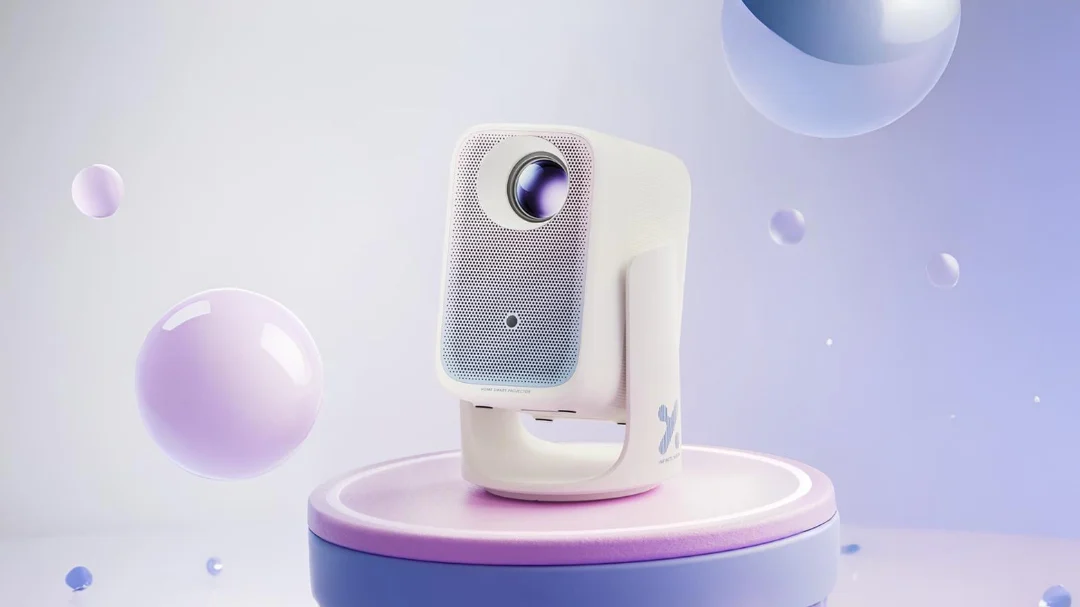 Xming Q6 Neo projector on a modern table, showcasing its gradient finish and dual-arm gimbal.