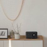 Optoma 4K home projector showcasing cinematic visuals in a modern living room