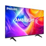 Philips Ambilight Roku TV glowing with immersive backlights in a modern living room.