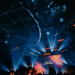 Laser projector beam of light in a dark venue