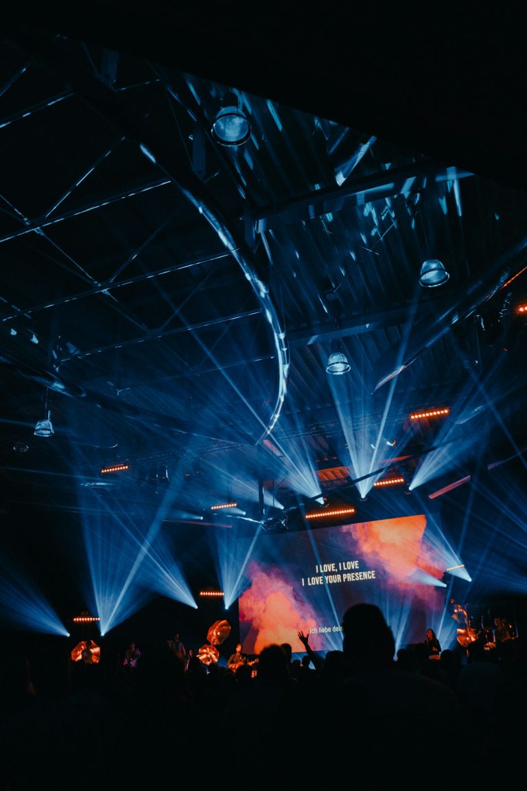 Laser projector beam of light in a dark venue
