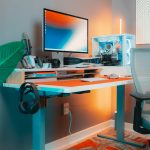 Desk with a computer monitor, keyboard and mouse